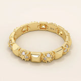 14k solid gold wedding band with pyramid-like angles and pave moissanite detailing. A bold yet refined geometric ring. Perfect as a modern wedding or stacking band.