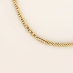 14k solid gold wheat chain necklace with a smooth, tightly woven texture. A classic gold chain with timeless appeal. Ideal for daily wear or layering.