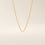 14k solid gold wheat chain necklace with a smooth, tightly woven texture. A classic gold chain with timeless appeal. Ideal for daily wear or layering.