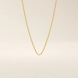 14k solid gold wheat chain necklace with a smooth, tightly woven texture. A classic gold chain with timeless appeal. Ideal for daily wear or layering.