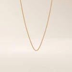 14k solid gold wheat chain necklace with a smooth, tightly woven texture. A classic gold chain with timeless appeal. Ideal for daily wear or layering.