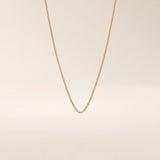 14k solid gold wheat chain necklace with a smooth, tightly woven texture. A classic gold chain with timeless appeal. Ideal for daily wear or layering.