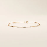14k solid rose gold bar chain bracelet with smooth rectangular accents, blending warm rosy tones with an understated, minimalist design.
