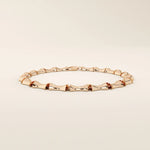 14k solid rose gold bone bracelet showcasing chunky, curved links with a bold polished surface.
