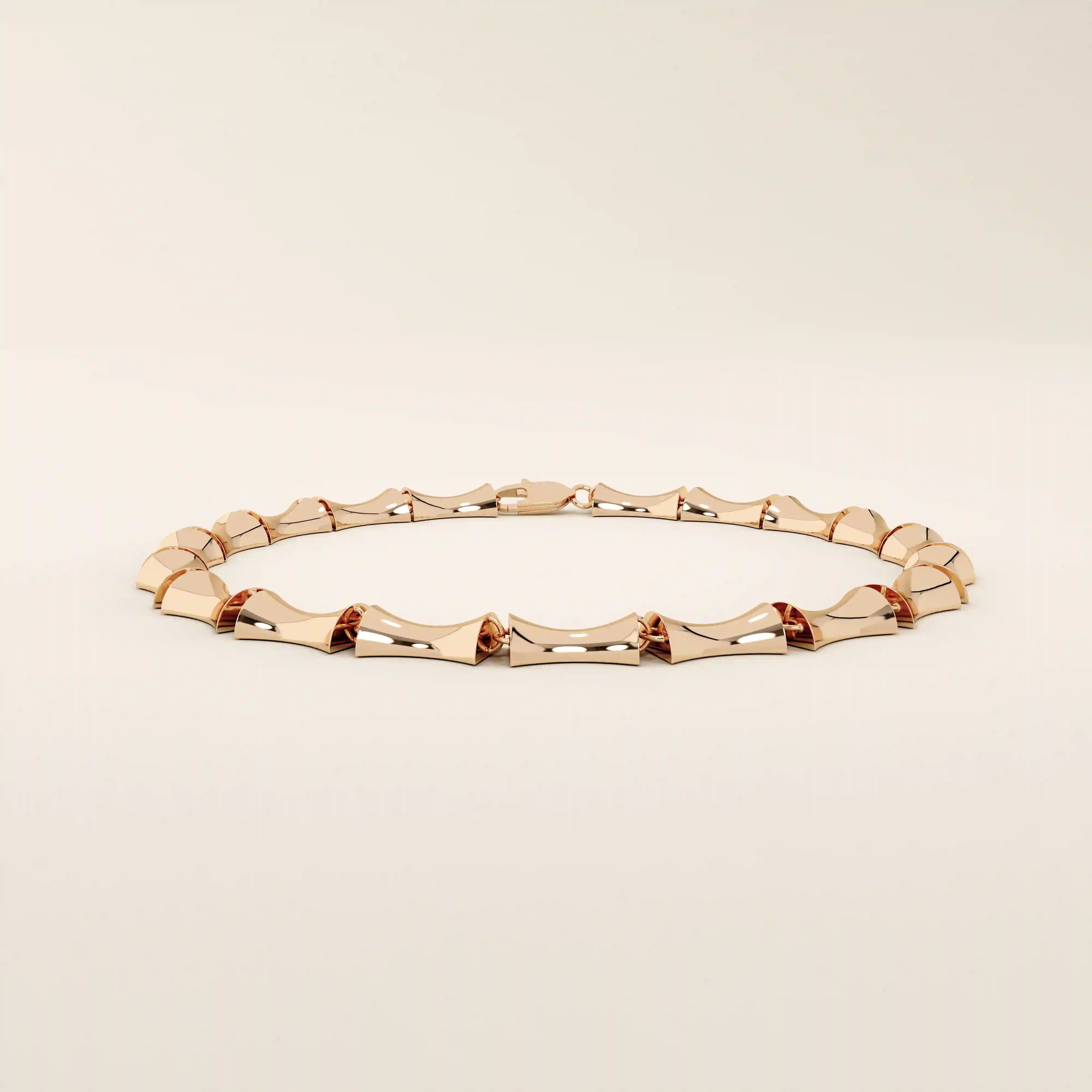 14k solid rose gold bone bracelet showcasing chunky, curved links with a bold polished surface.
