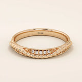 14k solid rose gold braided wedding band with a row of sparkling round diamonds, romantic and dainty design
