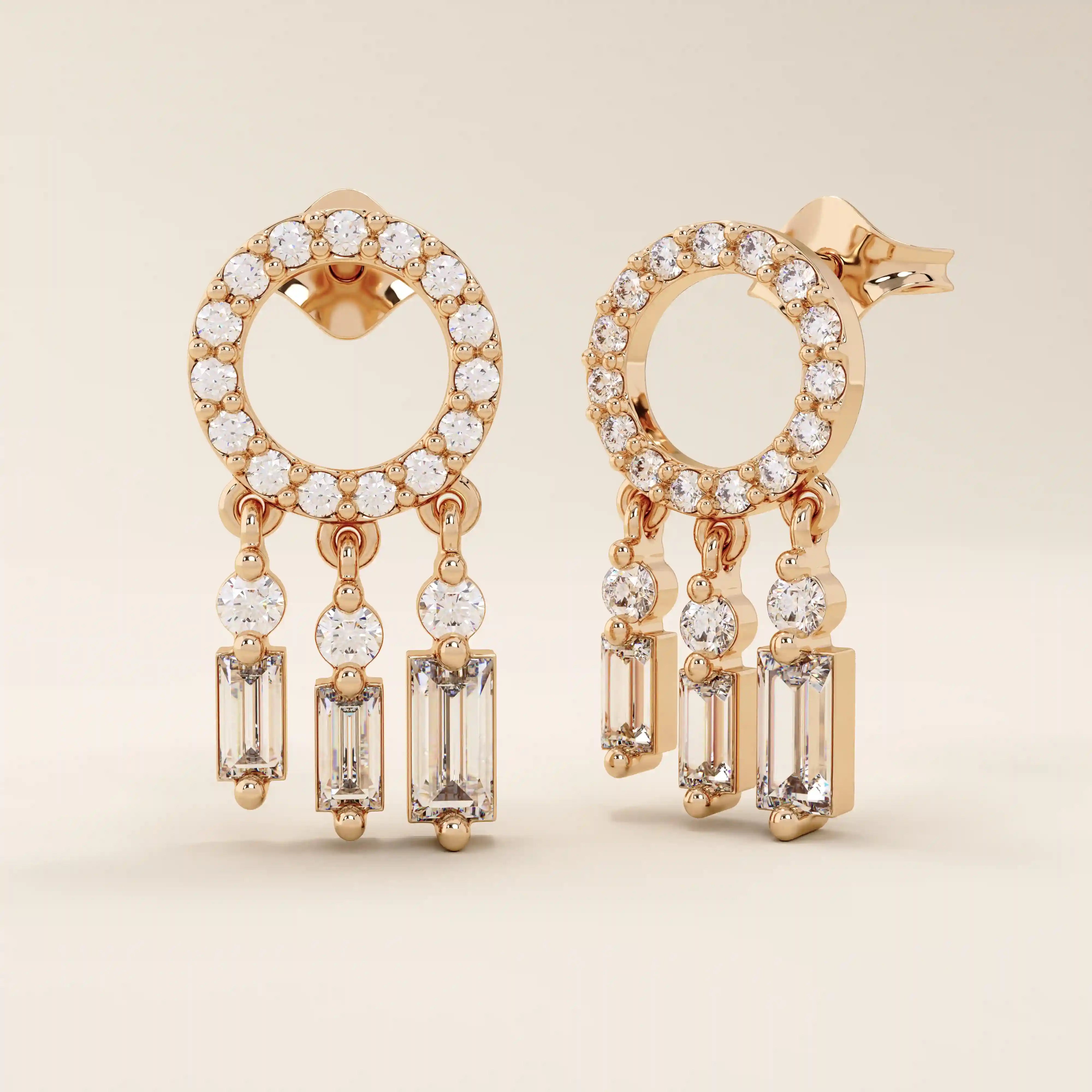 14k solid rose gold dreamcatcher-style stud earrings featuring a pavé-set open circle and three moissanite drop charms.
