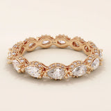 14k solid rose gold eternity ring showcasing sideways pear cut moissanite stones surrounded by pavé set round moissanite accents and ornate milgrain design, romantic fine jewelry gift
