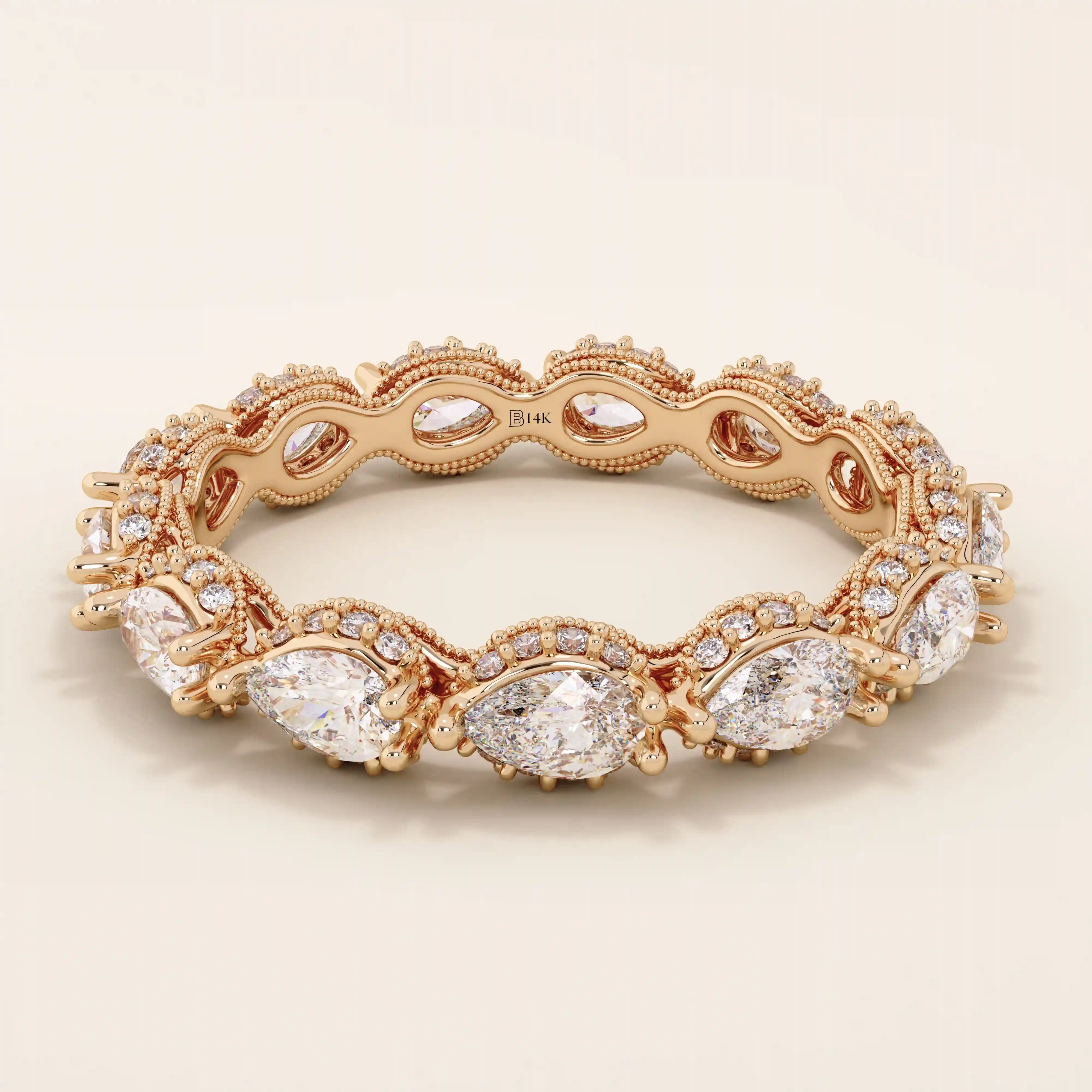 14k solid rose gold eternity ring showcasing sideways pear cut moissanite stones surrounded by pavé set round moissanite accents and ornate milgrain design, romantic fine jewelry gift
