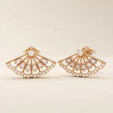 14k solid rose gold fan-shaped stud earrings with a refined lattice design, highlighted by glittering baguette and round moissanite accents.
