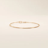 14k solid rose gold flat bar chain bracelet with polished rectangular accents, blending warm blush tones with a refined, minimal design.
