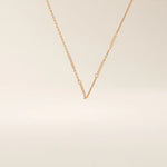 14k solid rose gold flat bar chain necklace showcasing slim rectangular bar stations placed evenly along the chain, blending warm tones with a contemporary design.
