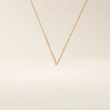 14k solid rose gold flat bar chain necklace showcasing slim rectangular bar stations placed evenly along the chain, blending warm tones with a contemporary design.
