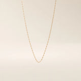 14k solid rose gold mariner chain necklace showcasing the signature flat bar-inset links, blending warm tones with timeless nautical elegance.
