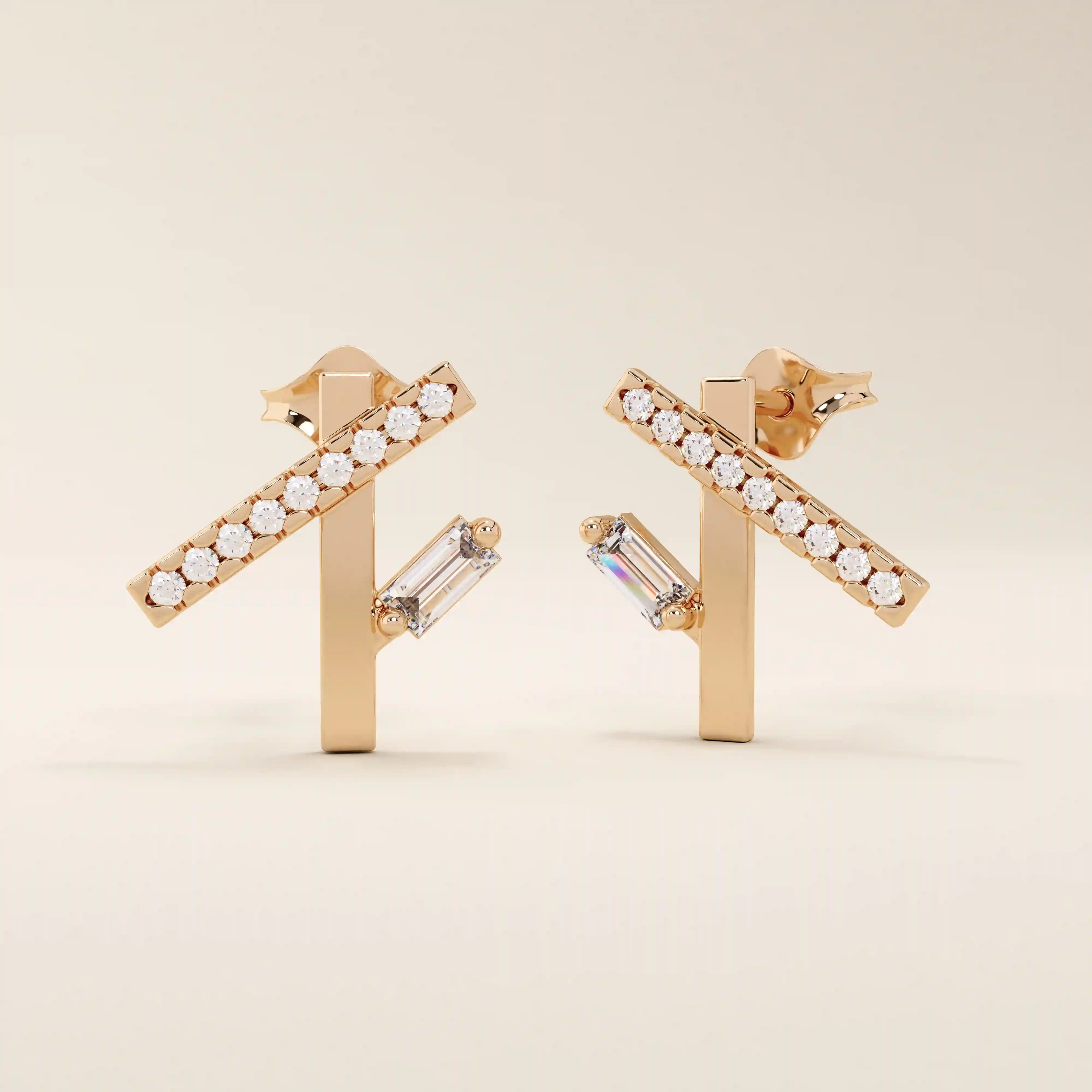 14k solid rose gold modern line studs with a row of sparkling moissanite rounds and a sleek baguette-cut moissanite drop accent.
