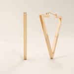 14k solid rose gold open triangle hoop earrings, blending warm, romantic tones with a sleek and angular geometric silhouette.
