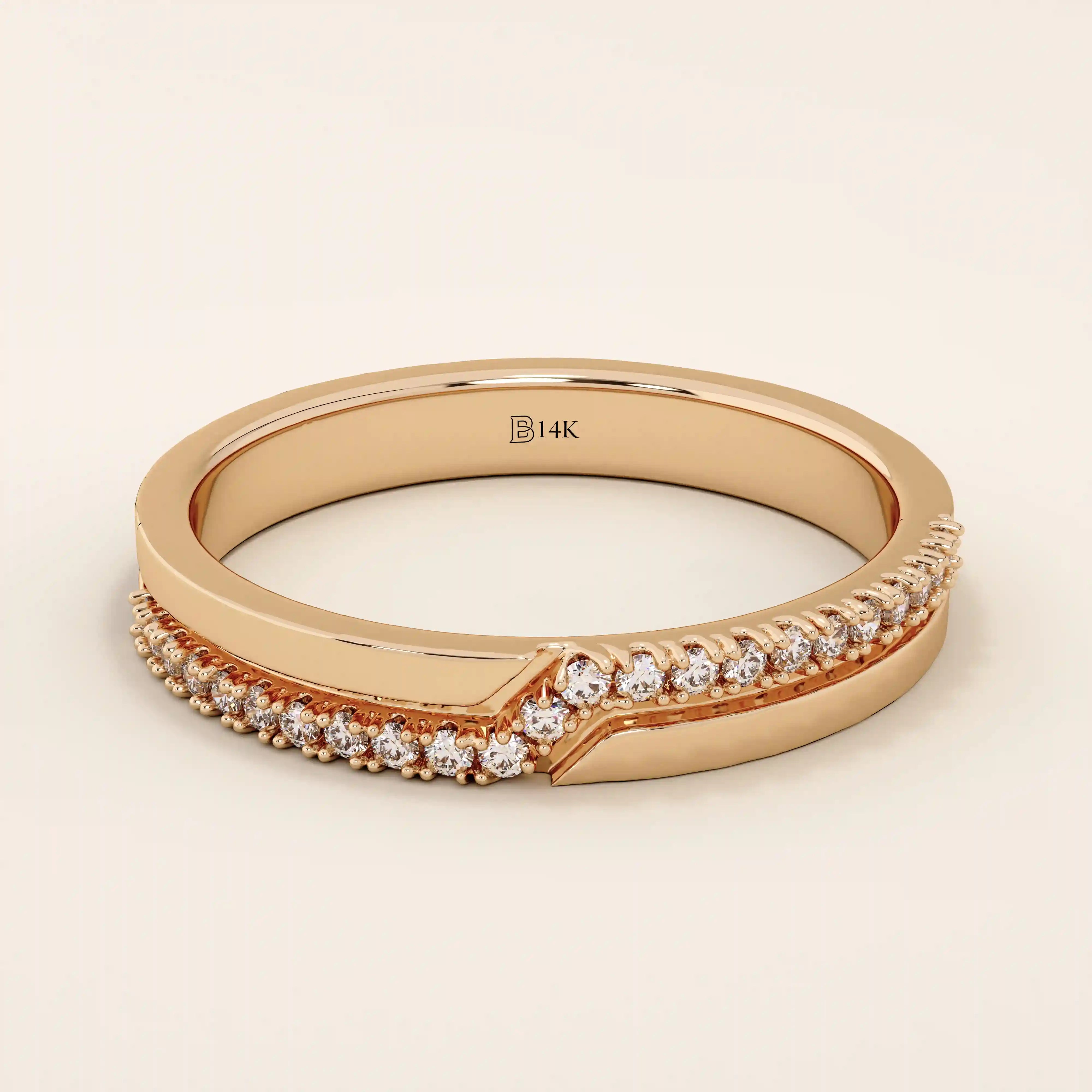 14k solid rose gold ring showcasing a pointed chevron design with pavé set round brilliant cut moissanite stones, romantic and stylish fine jewelry piece
 2