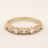 14k solid rose gold ring showcasing alternating baguette cut and round brilliant cut moissanite stones in a contemporary bezel setting, romantic fine jewelry gift

