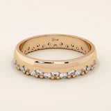 14k solid rose gold ring showcasing round brilliant cut moissanite stones in a single row with polished bead accents, romantic and refined fine jewelry piece

