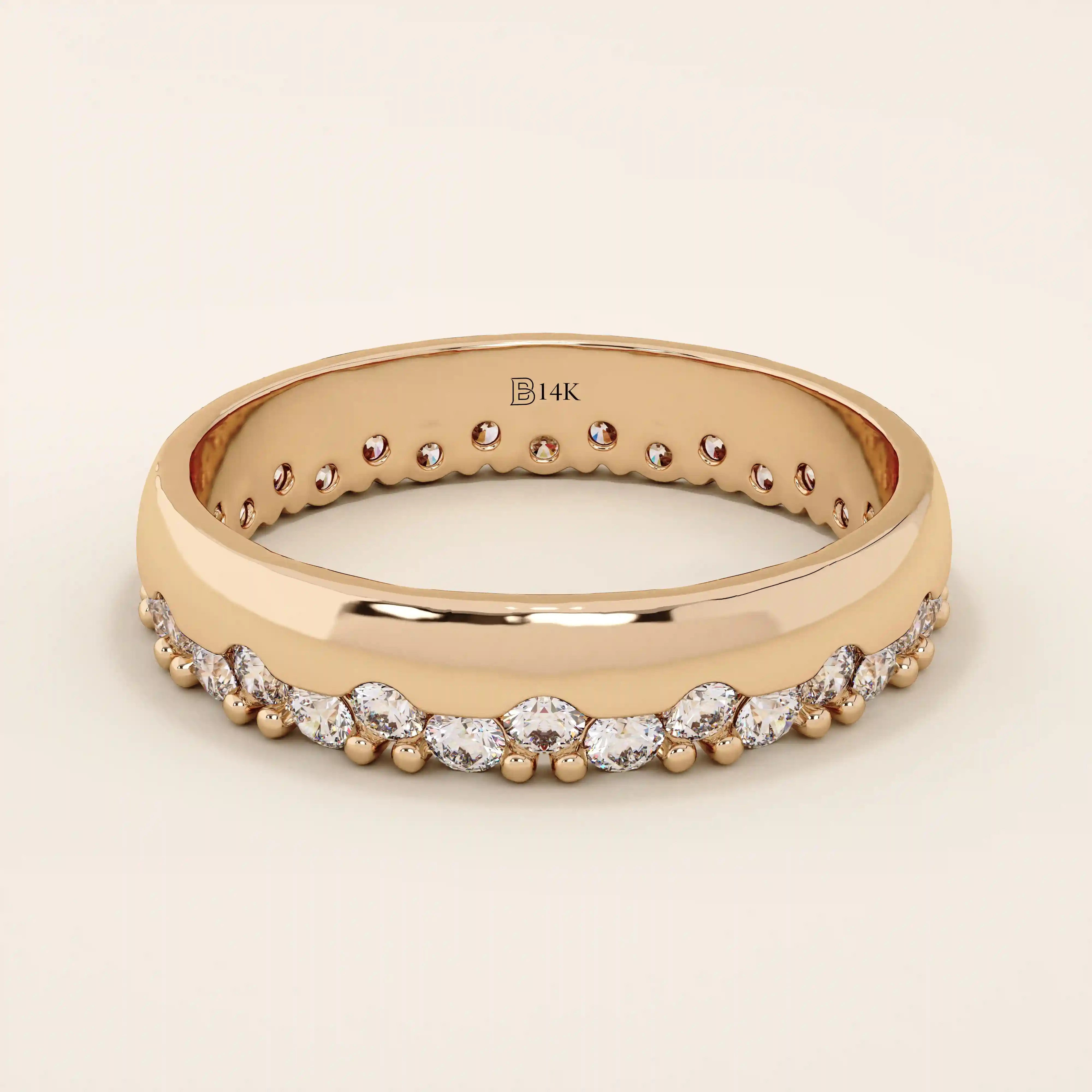 14k solid rose gold ring showcasing round brilliant cut moissanite stones in a single row with polished bead accents, romantic and refined fine jewelry piece
