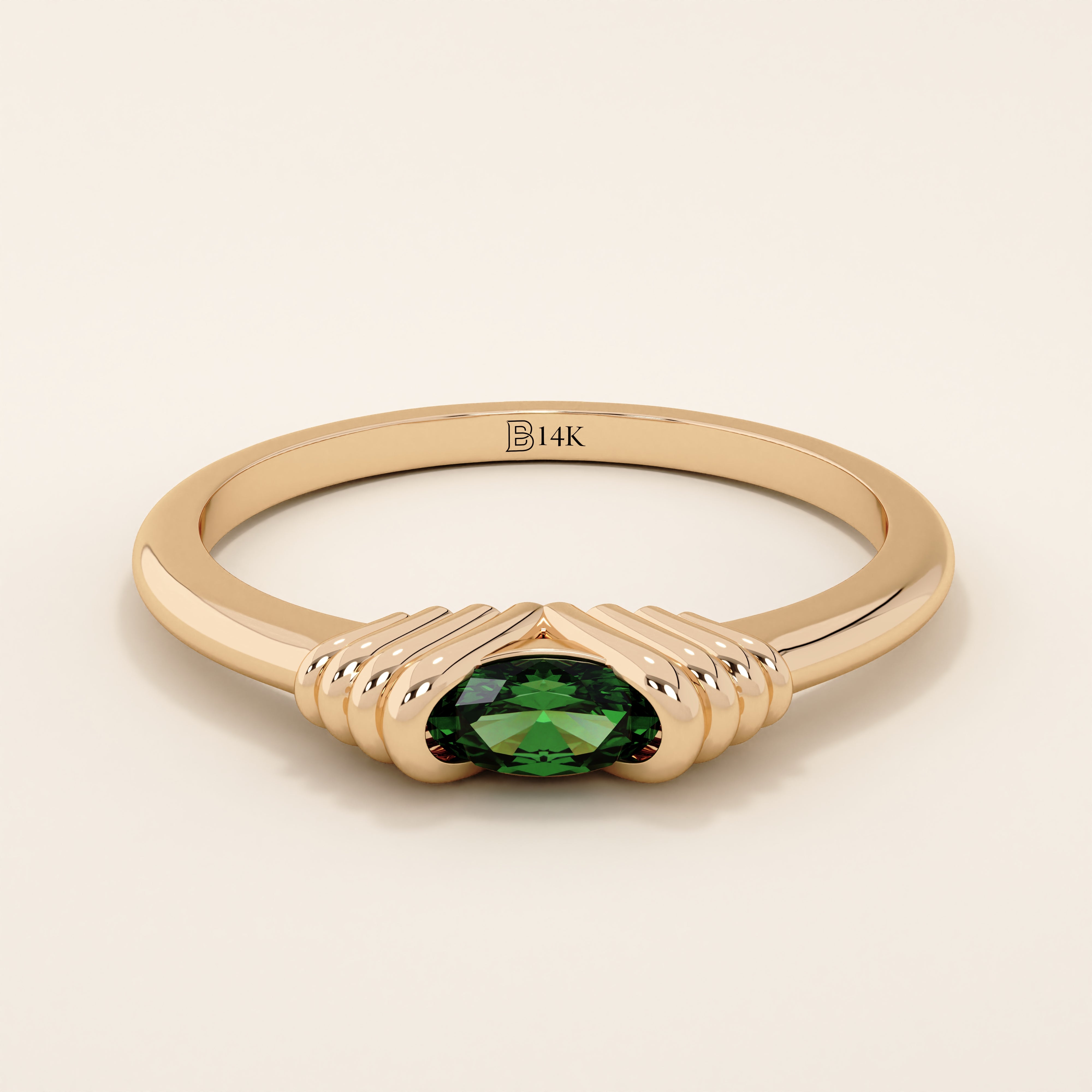 14k solid rose gold ring with an oval green gemstone secured in a ribbed split setting design.
