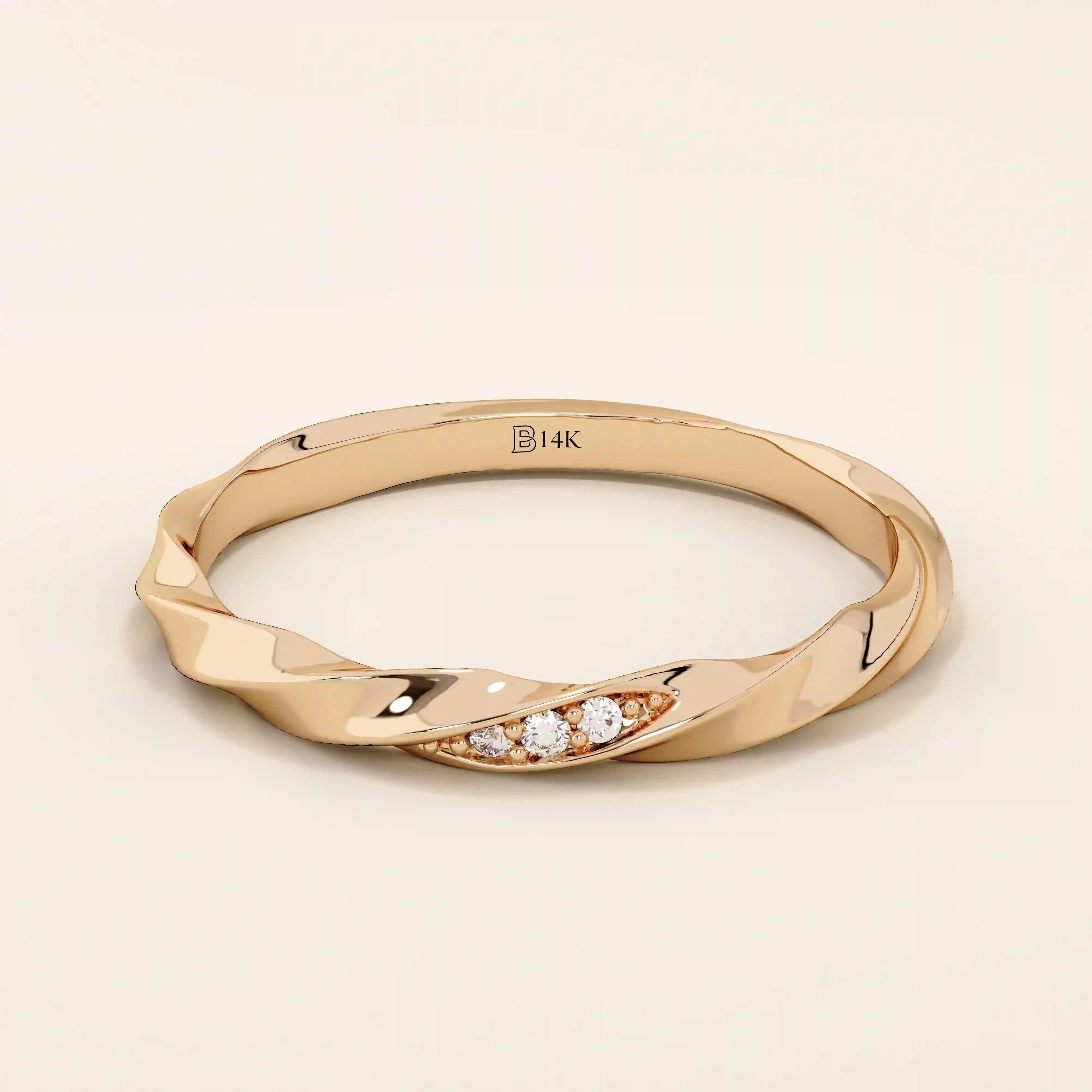 14k solid rose gold twisted wedding band with a cluster of sparkling round moissanites in a marquise-shaped opening, romantic fine jewelry
