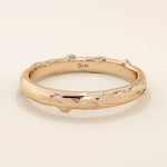 14k solid rose gold wedding band with an organic woodgrain pattern, rustic and modern design fusion
