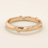 14k solid rose gold wedding band with an organic woodgrain pattern, rustic and modern design fusion
