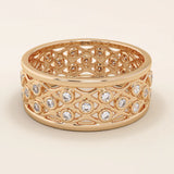 14k solid rose gold wide wedding band with a repeating open lattice pattern, bezel-set moissanite gemstones throughout
