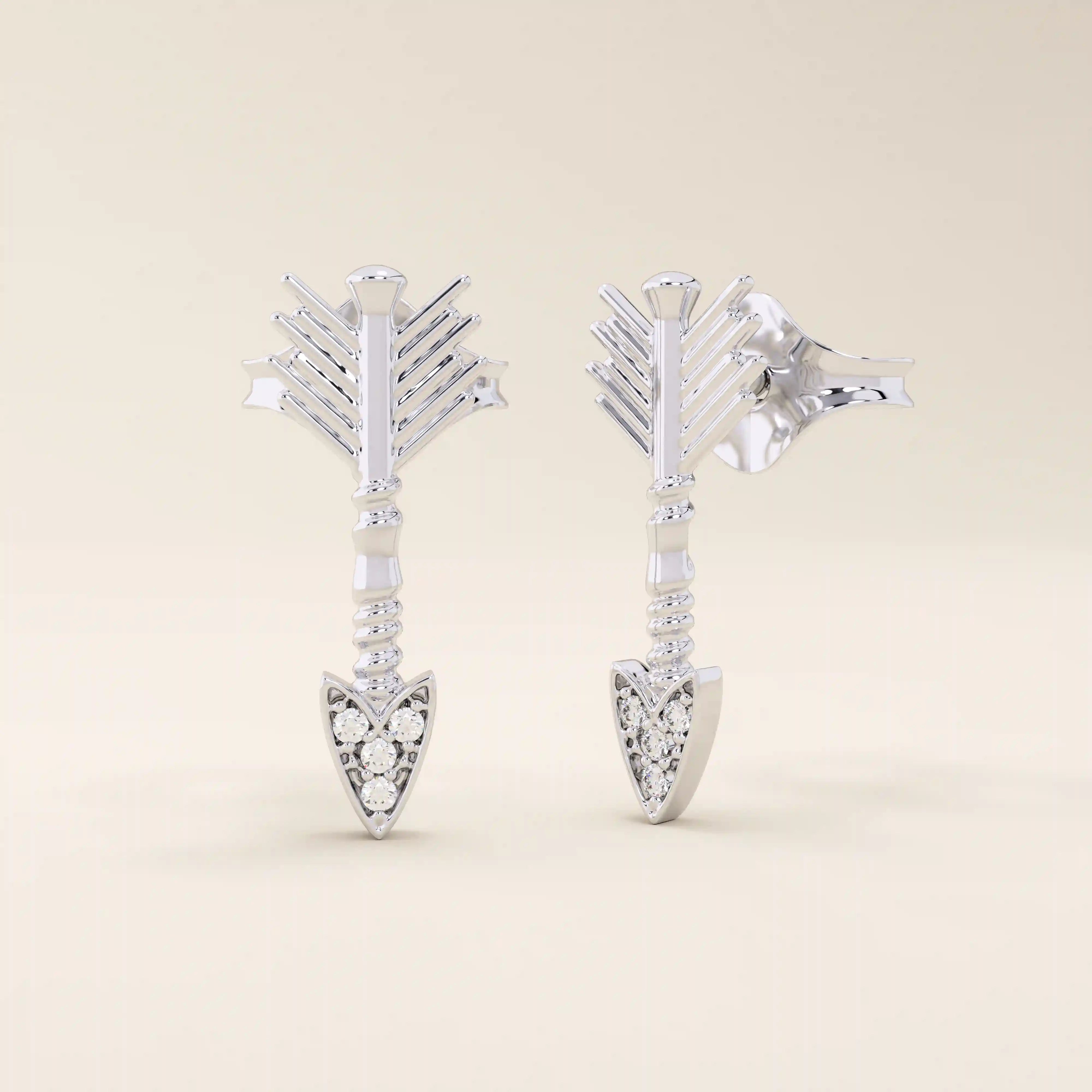 14k solid white gold arrow stud earrings with fine fletching texture and a moissanite-studded arrowhead for a sparkling finish.
