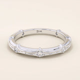 14k solid white gold bamboo-style wedding band, adorned with evenly spaced round brilliant-cut moissanites
