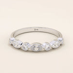 14k solid white gold band with alternating marquise cut and round brilliant cut moissanite stones in a polished bezel setting, timeless wedding or anniversary ring
