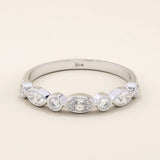 14k solid white gold band with alternating marquise cut and round brilliant cut moissanite stones in a polished bezel setting, timeless wedding or anniversary ring
