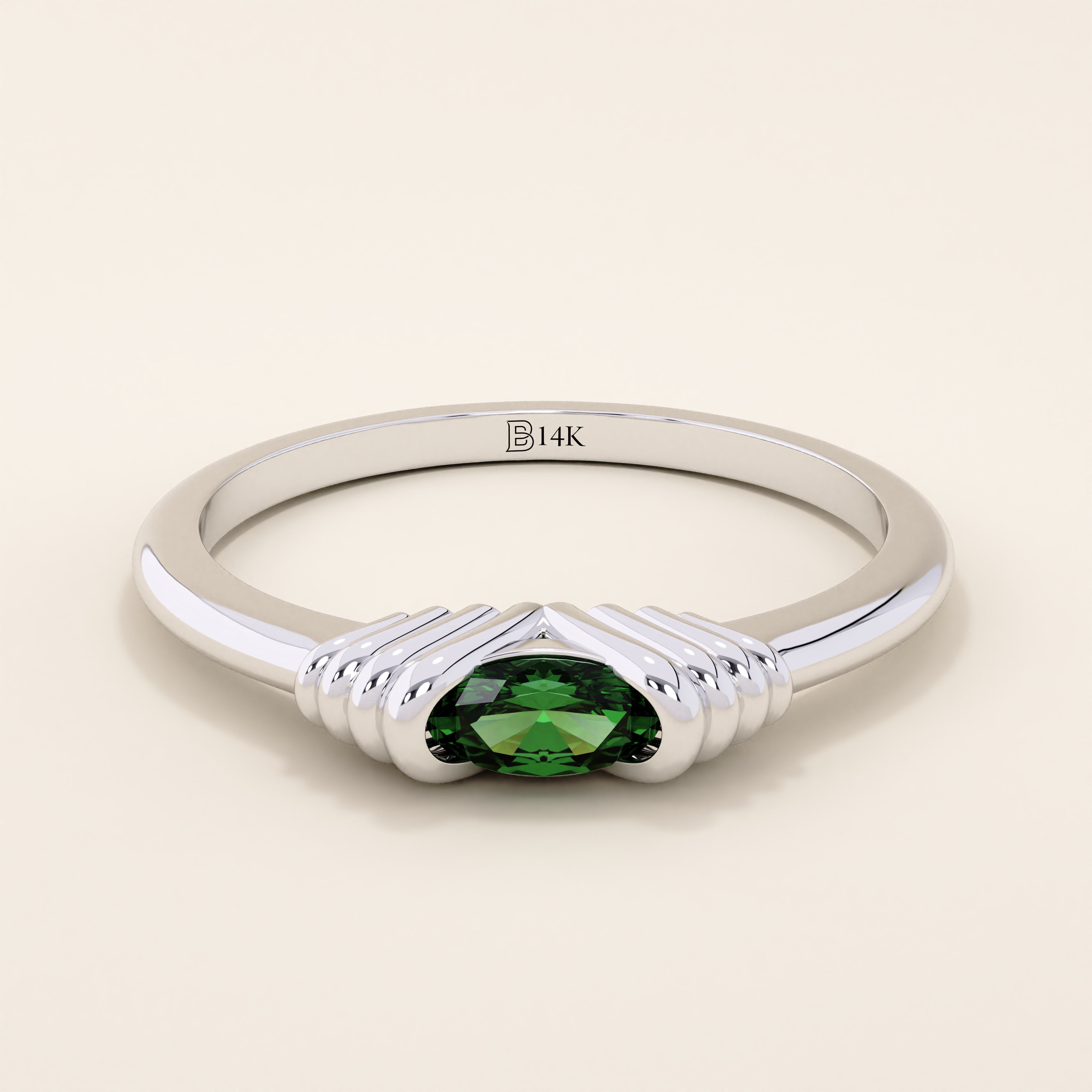 14k solid white gold band with an oval green gemstone set in a sculptural ribbed split mount.
