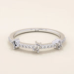 14k solid white gold band with three baguette cut moissanite stones set among pavé round moissanite accents, sleek and elegant wedding or anniversary ring
