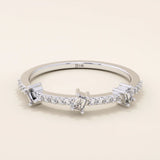 14k solid white gold band with three baguette cut moissanite stones set among pavé round moissanite accents, sleek and elegant wedding or anniversary ring
