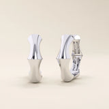14k solid white gold bone-style hoop earrings featuring fluid organic curves, sharp detailing, and a sleek polished finish.
