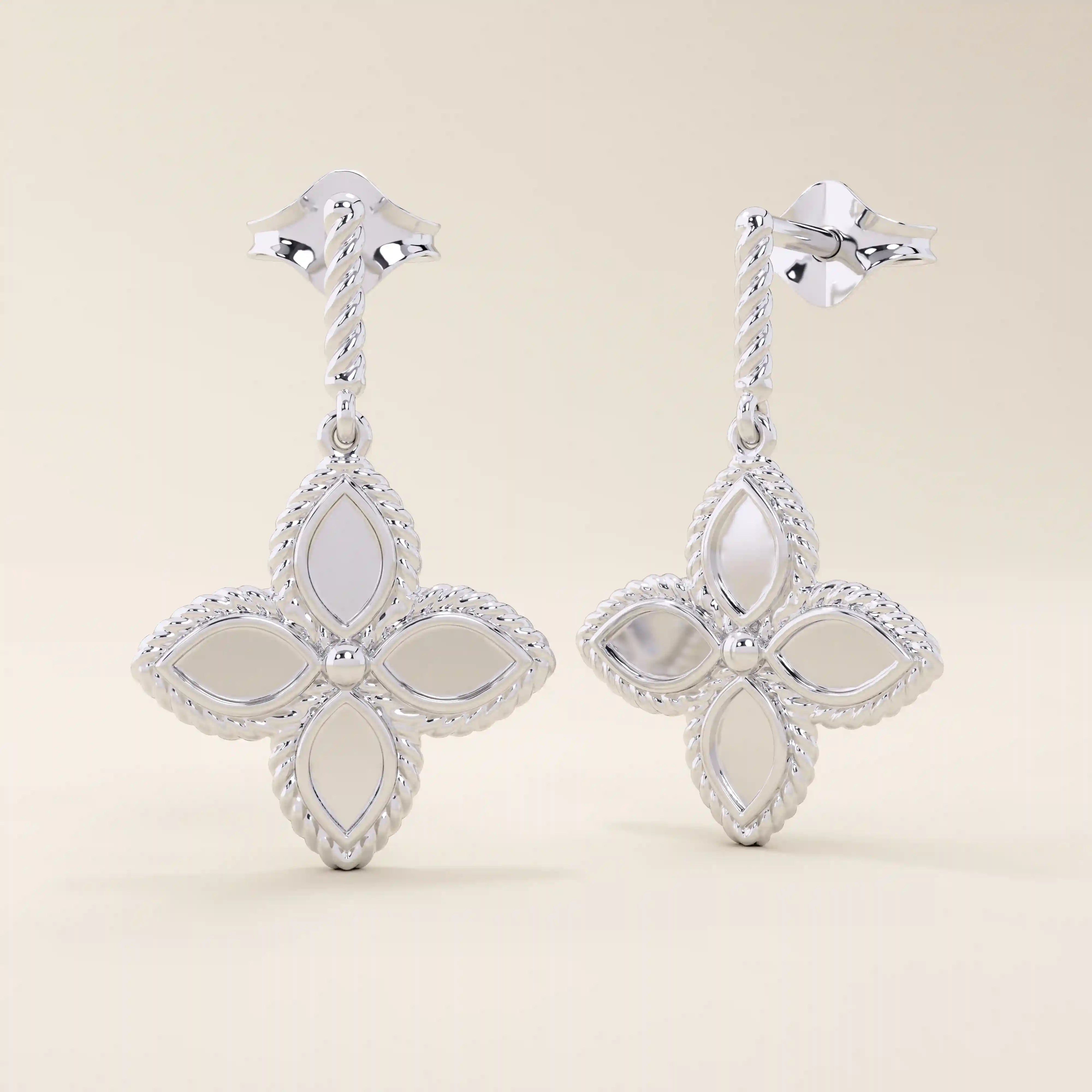 14k solid white gold dangle clover stud earrings with a rope-textured post and a polished four-petal floral drop framed by milgrain details.
