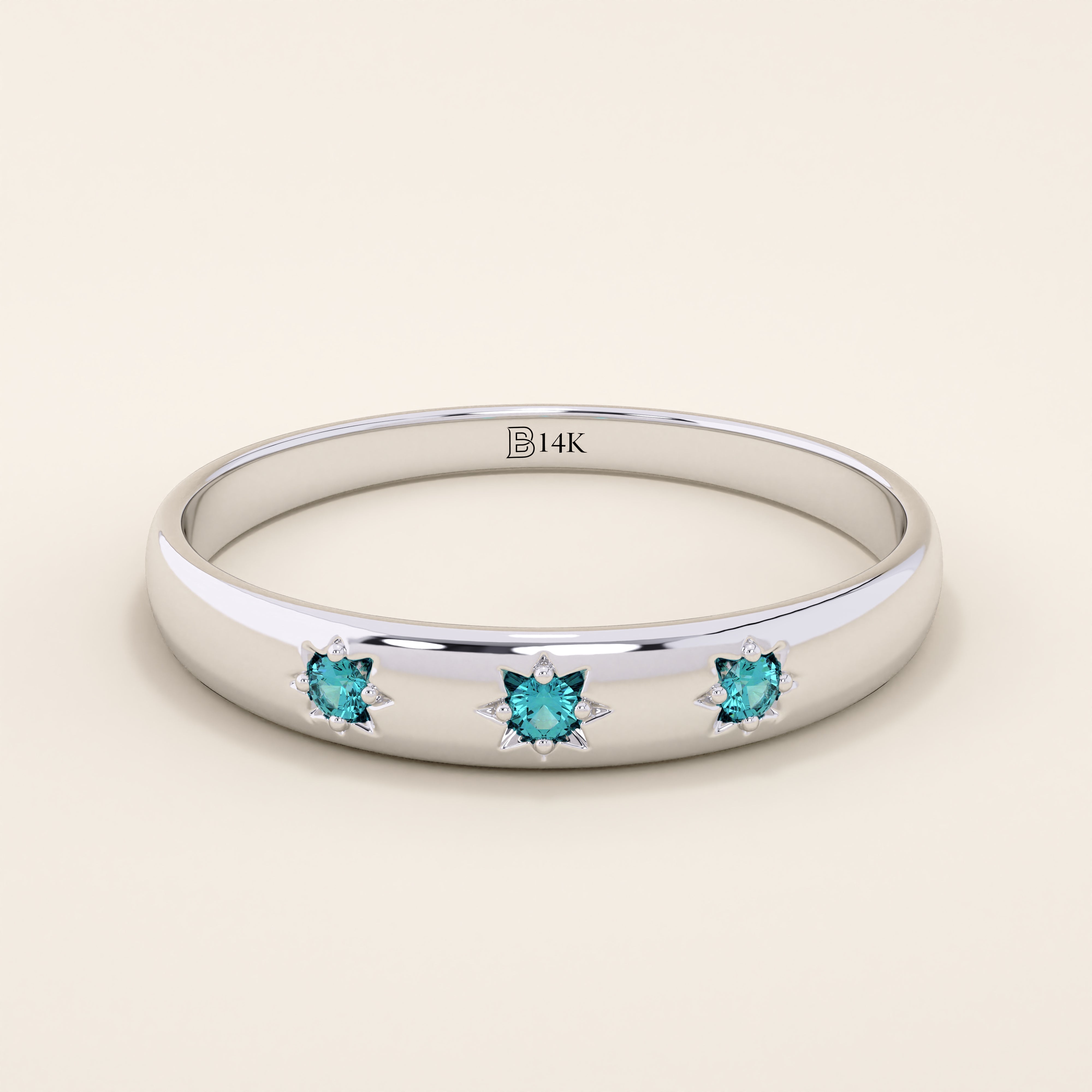 14k solid white gold dome ring with three bright aquamarine stones, each held in star-shaped settings along the band.