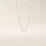 14k solid white gold dot chain necklace with polished flat square stations evenly distributed along the chain, offering a minimalist yet eye-catching design.
