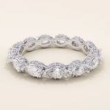 14k solid white gold eternity band with sideways pear cut moissanite stones framed by pavé set round moissanite accents and detailed milgrain edges, elegant wedding or anniversary ring

