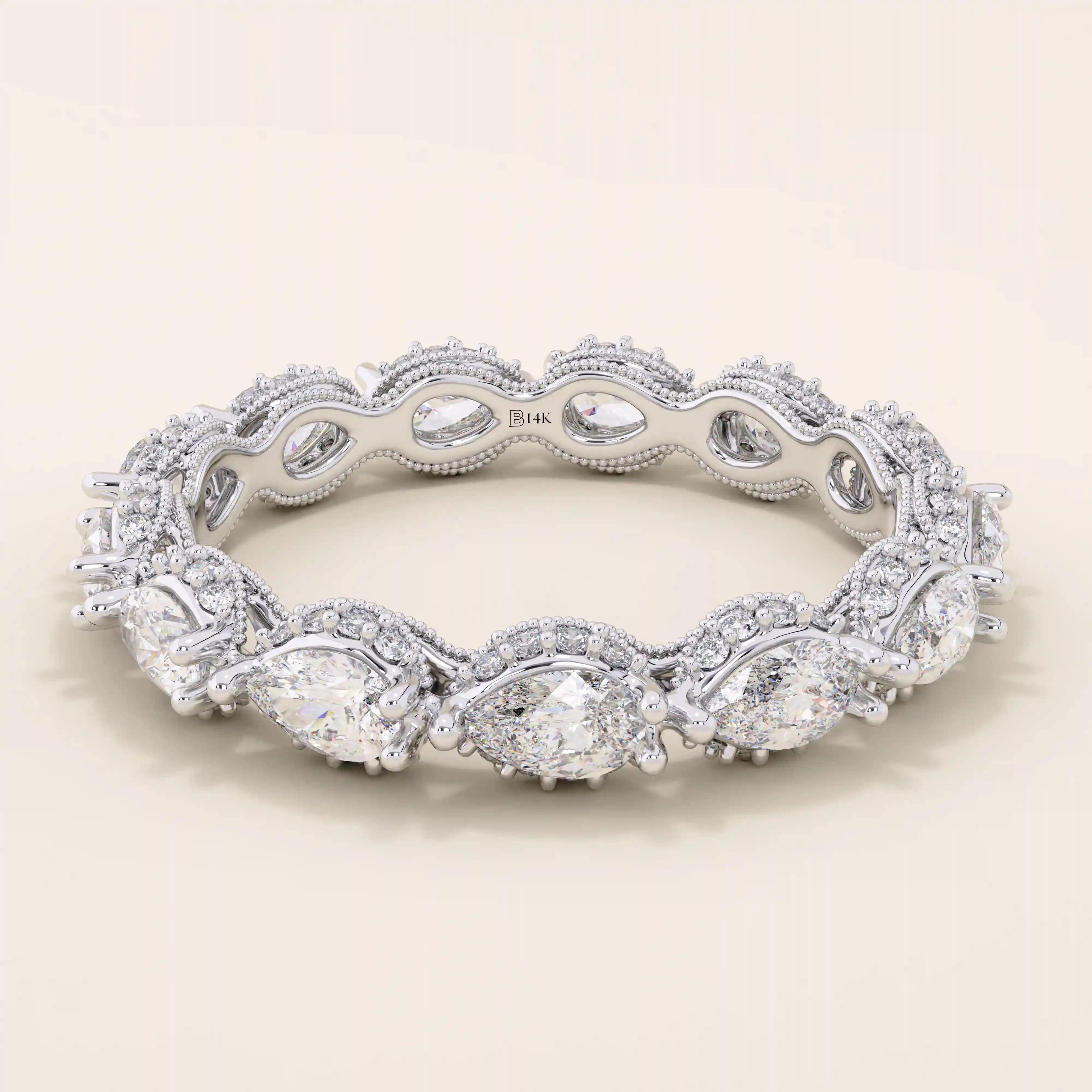 14k solid white gold eternity band with sideways pear cut moissanite stones framed by pavé set round moissanite accents and detailed milgrain edges, elegant wedding or anniversary ring
