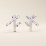 14k solid white gold geometric line stud earrings featuring pavé-set moissanite rounds on a bar with a vertical baguette stone below.
