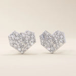 14k solid white gold heart stud earrings with a dazzling arrangement of baguette and round white moissanite stones, creating a brilliant, multi-faceted surface.

