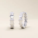 14k solid white gold hoop earrings crafted from a sequence of smooth, interconnected hexagon shapes, giving a modern geometric twist to a classic hoop.
