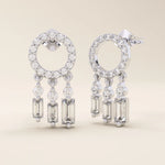 14k solid white gold pavé circle stud earrings with triple dangling moissanite accents in round and baguette cuts.
