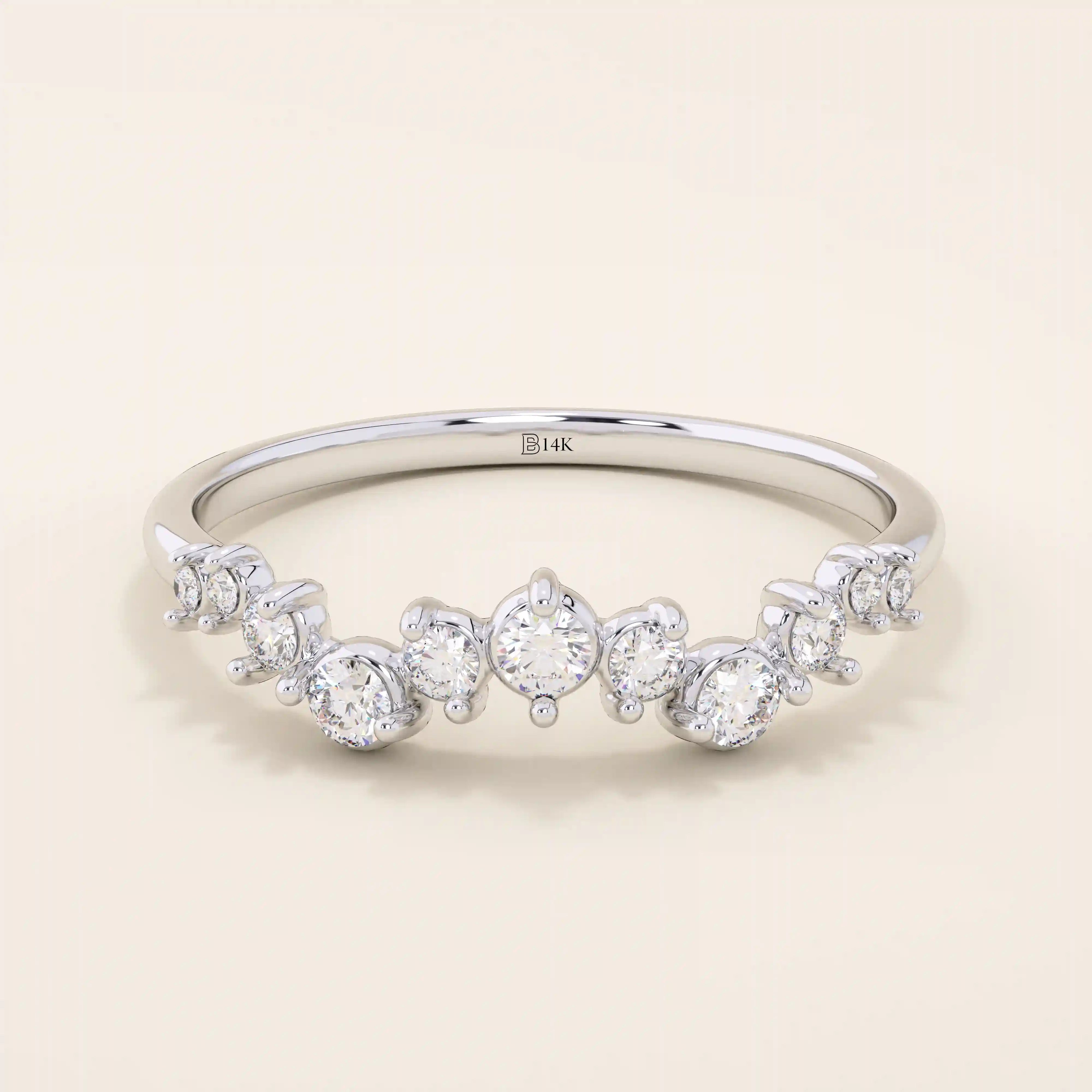 14k solid white gold ring featuring a half-eternity of alternating round moissanite stones in varied sizes.
