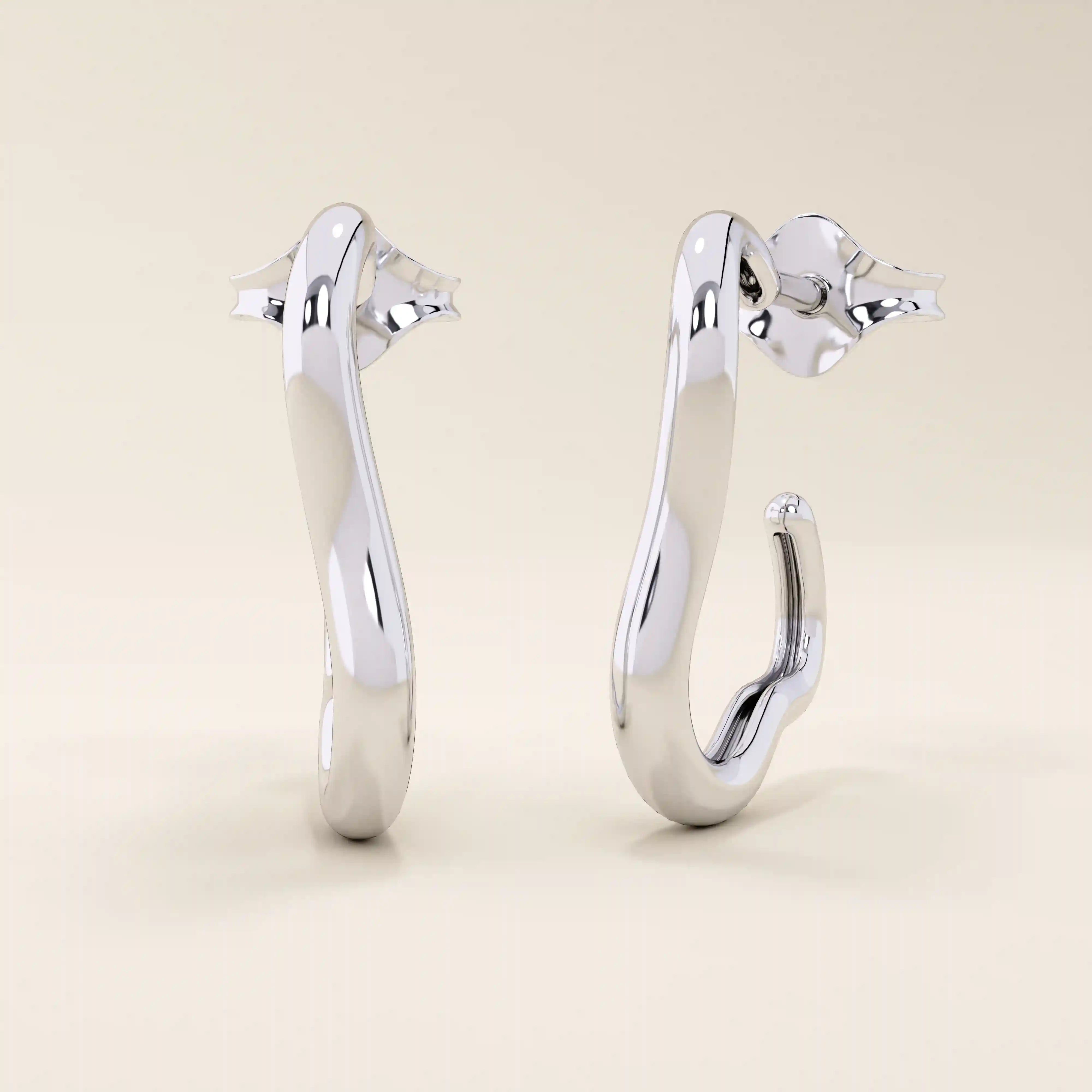 14k solid white gold sculptural hoop studs featuring an organic, abstract shape with a sleek polished surface.
