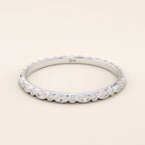 14k solid white gold slim wedding band with an engraved marquise motif encircling the ring.
