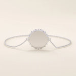 14k solid white gold sun bracelet with a polished circular sun-inspired medallion and fine chain design.
